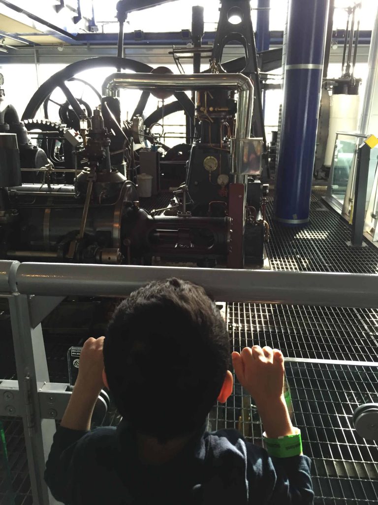 Boy looking at an engine Thinktank Birmingham
